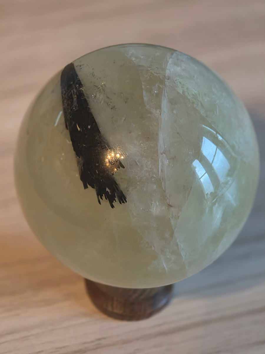 Crystal sphere with black tourmaline inclusion – grounding and protection crystals