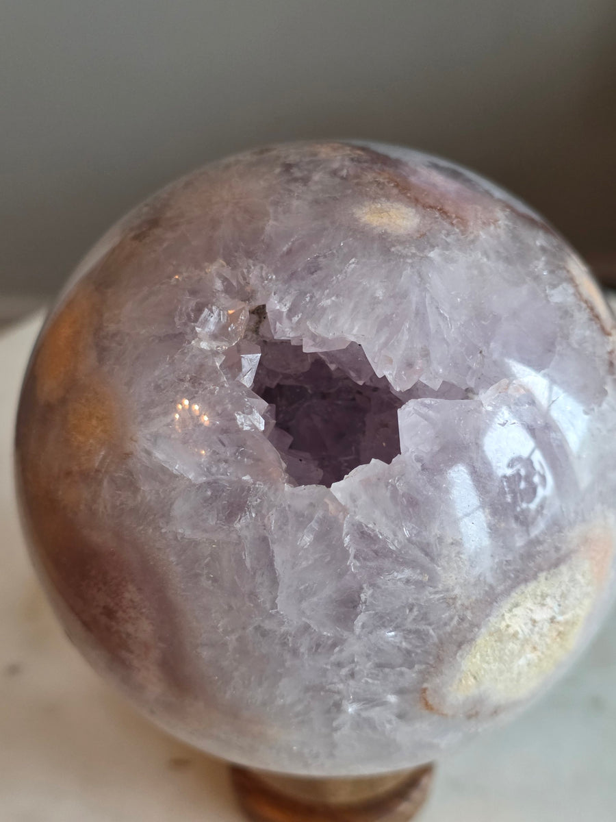 Lavender amethyst geode sphere 1.18kg, 9.9cm, from Brazil – front view with crystal cavity