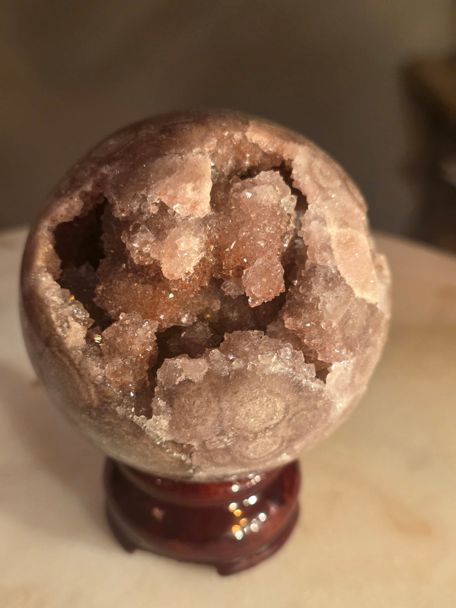 Pink amethyst geode sphere 371g from Brazil with sparkling druzy cavity – front view