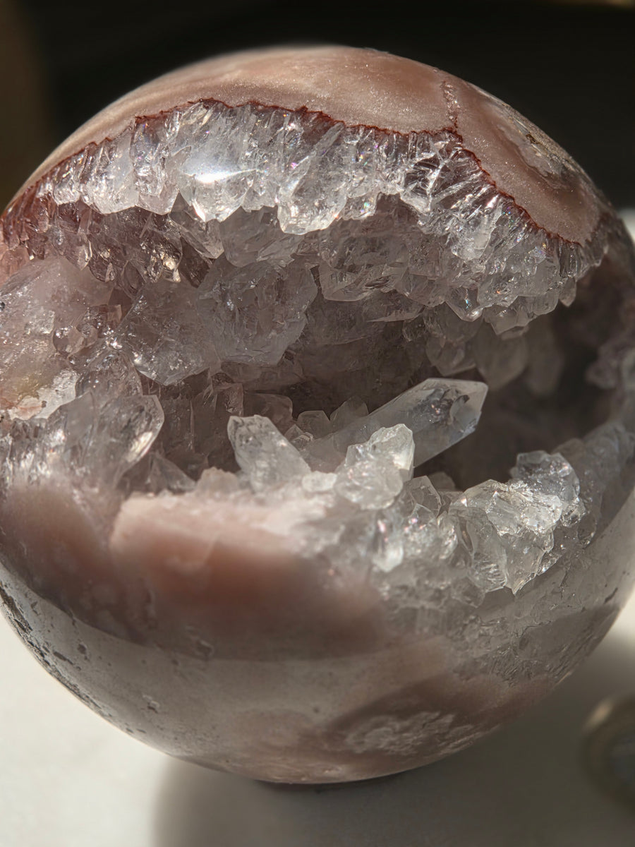 Pink amethyst druzy sphere 1.11kg from Brazil with geode cave opening, front view