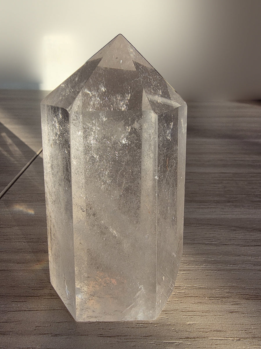 Polished clear quartz crystal point