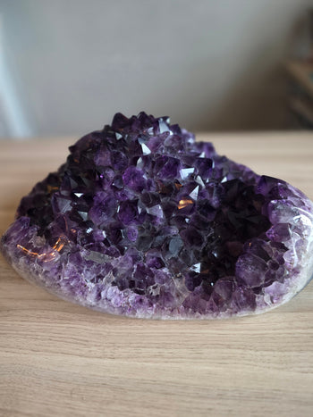 Large amethyst geode cluster 20.2kg from Brazil, 42cm long – side view of deep purple crystal mound