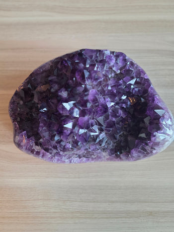 Top view of 42cm x 26cm amethyst geode cluster packed with deep purple crystal points