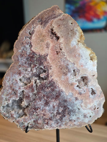 Full face of pink amethyst slab with peach-pink chalcedony band and raspberry druzy