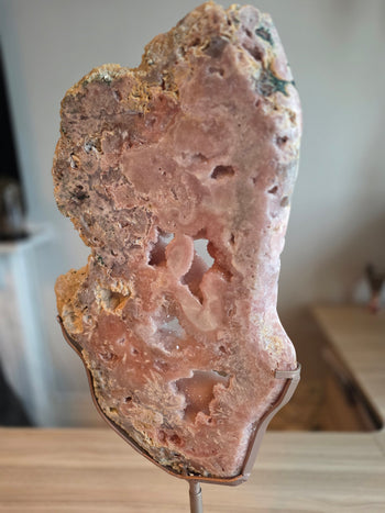 Angled view of 60cm pink amethyst slab on its display stand
