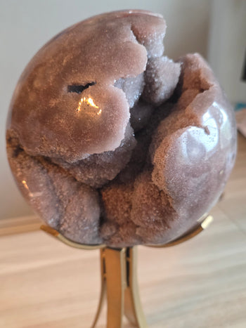 Caramel and rose druzy on the side of a pink amethyst geode sphere