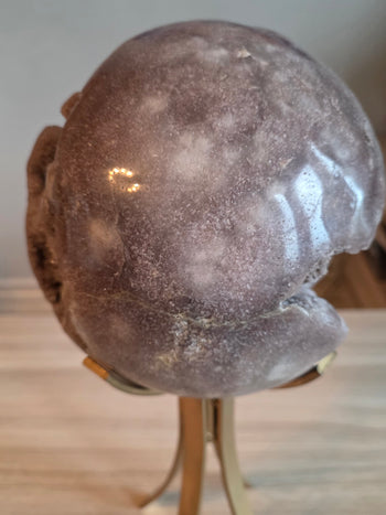 Polished dusky mauve back of a 7.2kg pink amethyst sphere