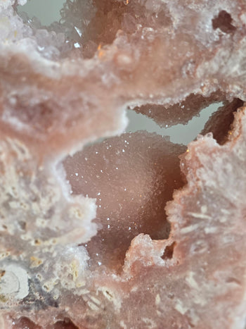 Soft pink sugar-like druzy dome inside a pink amethyst slab
