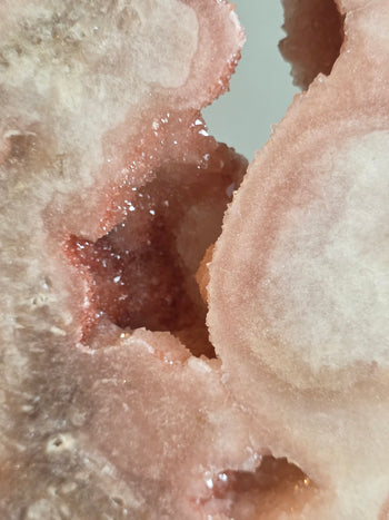 Raspberry-pink crystal cave inside a Brazilian pink amethyst slab