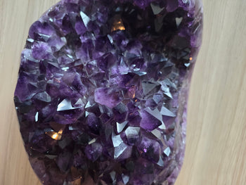 Detail of glassy amethyst crystal faces catching the light