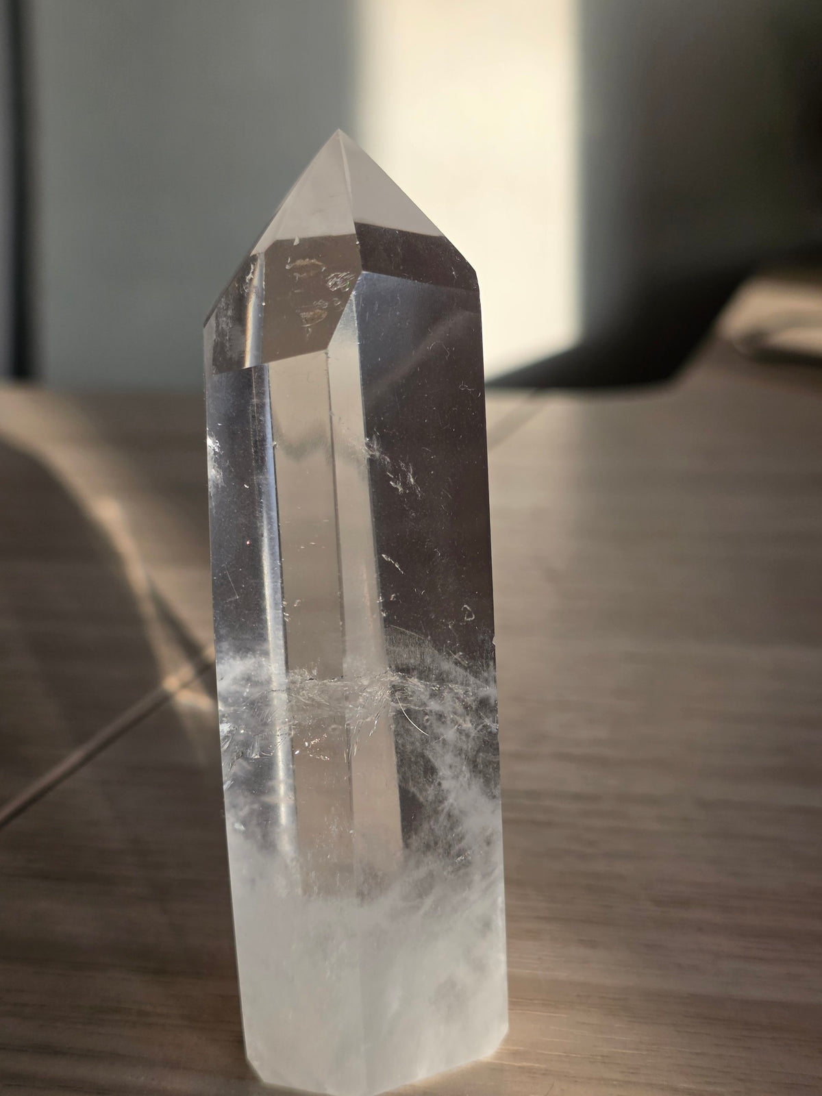 Clear quartz tower 10.5cm from Brazil, polished six-sided crystal point, front view