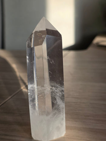 Clear quartz tower 10.5cm from Brazil, polished six-sided crystal point, front view
