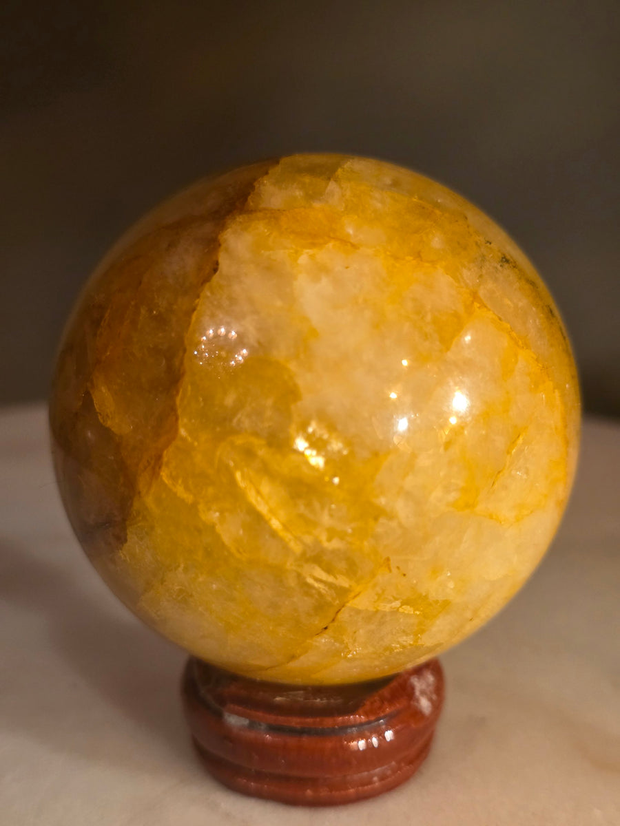 Golden healer quartz sphere 244g, 5.7cm, polished crystal ball from Brazil – front view