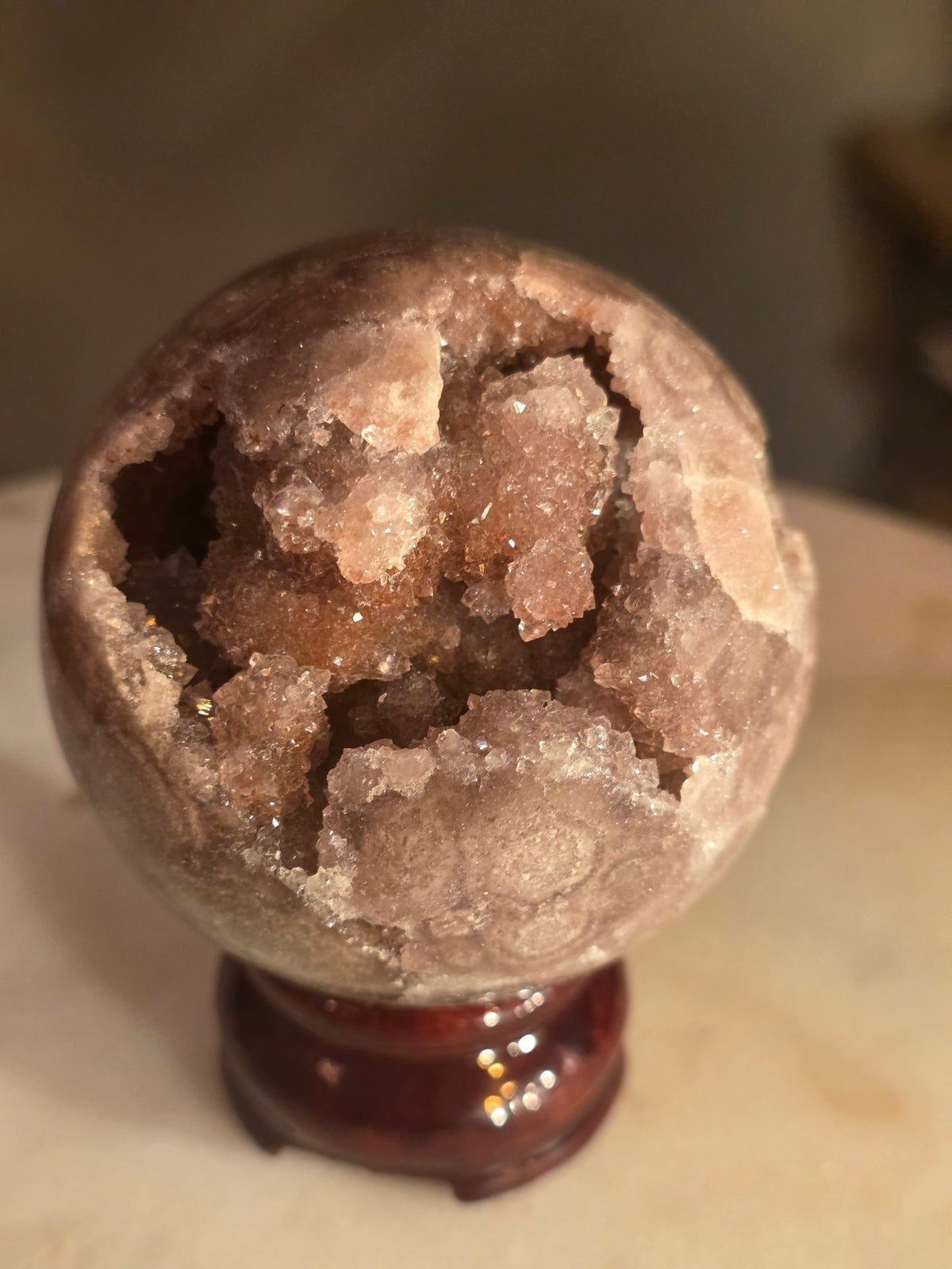 Pink amethyst geode sphere 371g from Brazil with sparkling druzy cavity – front view