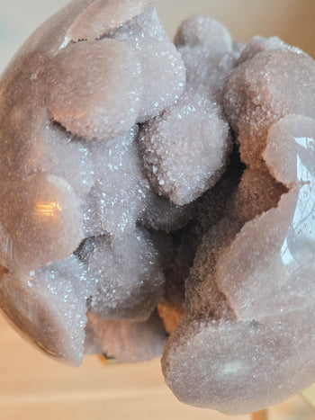 Detail of lilac pink amethyst druzy with white crystal sprays