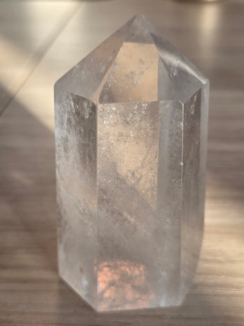 Sparkling inclusions inside a 266g clear quartz tower