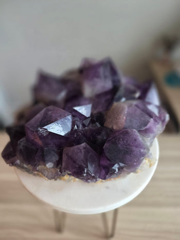 Side view of large Congo amethyst cluster with chunky royal purple crystals