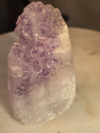 Close-up of amethyst points on a natural Brazilian amethyst cut-base piece