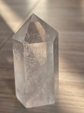Clear quartz tower 266g in sunlight, angled view