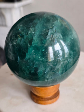 Deep emerald side of a large 2.1kg green fluorite sphere from Brazil