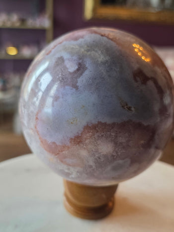 Pink and powder-blue chalcedony plumes on the back of a lavender amethyst sphere