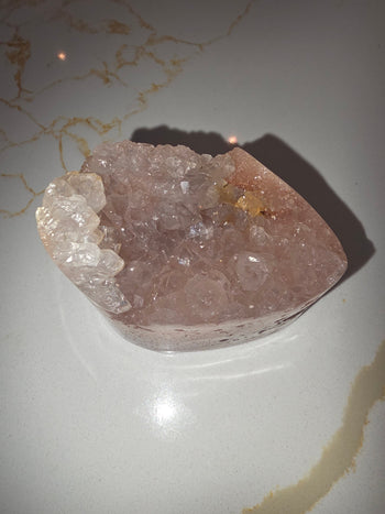 Top view of 317g pink amethyst cut-base geode showing the crystal-filled opening