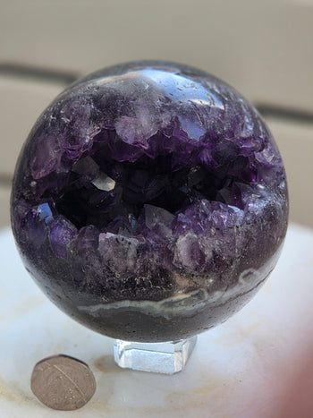 Brazilian amethyst geode sphere 925g, polished crystal ball, side view