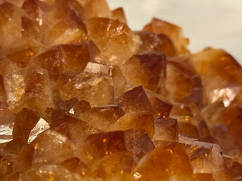 Detail of amber citrine crystal points catching the light
