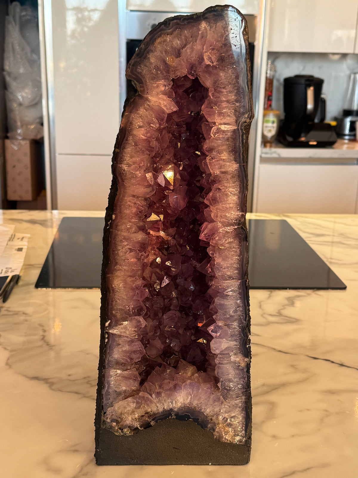 Large amethyst cathedral geode 14.4kg with deep violet crystal chamber, front view on stand