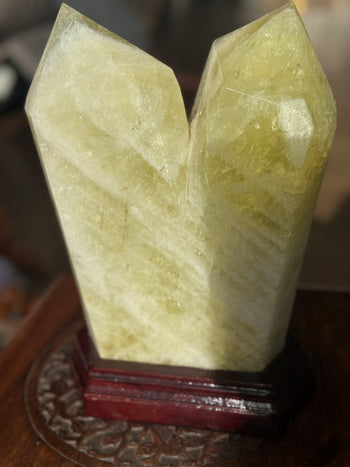 Pale lemon-yellow citrine tower 5.6kg with natural banding, side view