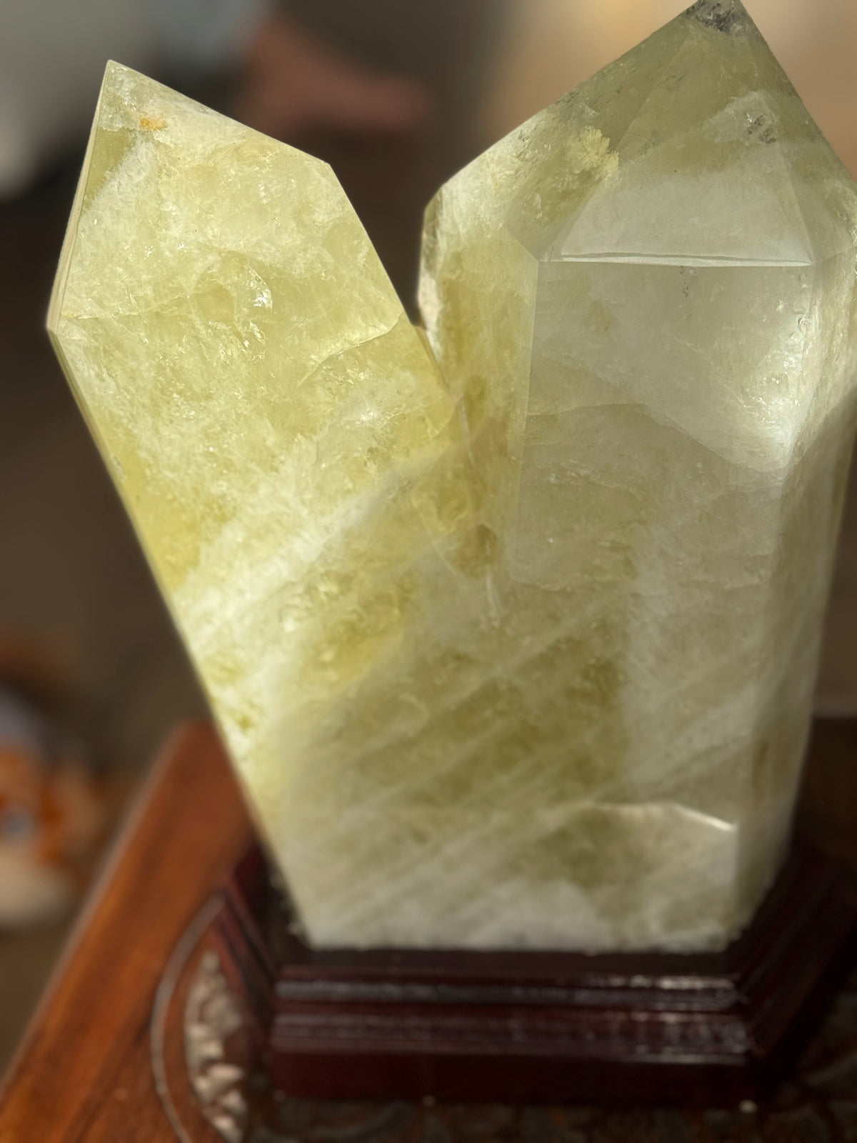 Large 5.6kg citrine twin-point tower on a dark wooden stand, front view