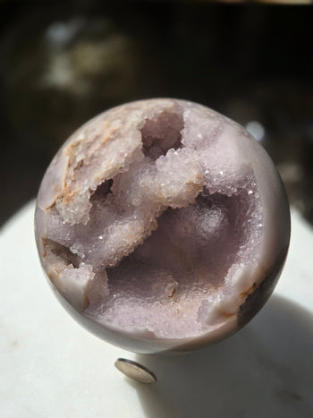 Natural pink amethyst geode sphere 1.19kg, polished crystal ball, side view