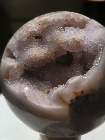 Pink amethyst sphere 1.19kg, soft pink polished surface