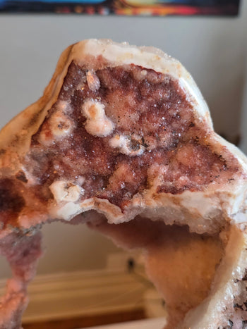 Raspberry druzy pocket with white crystal rosettes in pink amethyst